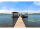 Waterfront home with a private dock and boat house extending into the lake at 20926 Ragan Ln, Land O Lakes, FL 34638