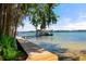Waterfront home with a private dock and boat house extending into the lake at 20926 Ragan Ln, Land O Lakes, FL 34638
