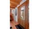Elegant entry foyer featuring a decorative wooden front door and hardwood floors at 20926 Ragan Ln, Land O Lakes, FL 34638