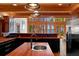 An open, wood-accented kitchen boasting modern appliances and a scenic outdoor view at 20926 Ragan Ln, Land O Lakes, FL 34638