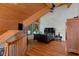 Charming bedroom with wooden ceiling beams and large window offering serene natural views at 20926 Ragan Ln, Land O Lakes, FL 34638