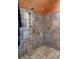 Tiled shower featuring a shower head and stylish fixtures at 20926 Ragan Ln, Land O Lakes, FL 34638