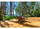 Backyard wooden deck with outdoor dining set. Enjoy a backyard meal with great views of nature and water at 20926 Ragan Ln, Land O Lakes, FL 34638