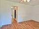 Bedroom featuring gleaming hardwood floors and a clean, minimalist design at 2100 World Parkway Blvd # 50, Clearwater, FL 33763