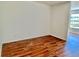 Bedroom featuring gleaming hardwood floors and a clean, minimalist design at 2100 World Parkway Blvd # 50, Clearwater, FL 33763
