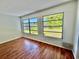 Sunlit bedroom with large windows showcasing a serene outdoor view at 2100 World Parkway Blvd # 50, Clearwater, FL 33763