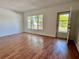 The living room has wood floors, white walls, and a large window at 2100 World Parkway Blvd # 50, Clearwater, FL 33763