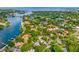 Picturesque aerial view showcases a waterfront community with lush greenery and stunning ocean views at 2217 Brevard Ne Rd, St Petersburg, FL 33704