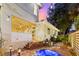 Relaxing backyard featuring a spa and string lights, perfect for evening enjoyment and entertainment at 2217 Brevard Ne Rd, St Petersburg, FL 33704