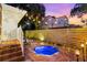 Beautiful backyard view with an in-ground spa, brick pavers and stylish lighting at 2217 Brevard Ne Rd, St Petersburg, FL 33704