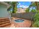 Inviting backyard with a relaxing hot tub and well-maintained brick patio for outdoor enjoyment at 2217 Brevard Ne Rd, St Petersburg, FL 33704