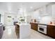 Open kitchen area with a large island, sleek cabinetry, and modern appliances, perfect for cooking and entertaining at 2217 Brevard Ne Rd, St Petersburg, FL 33704