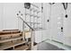 Functional laundry room with washer, dryer, shelving and access to stairs at 2217 Brevard Ne Rd, St Petersburg, FL 33704