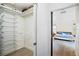 Walk-in closet with wire shelving, offering ample storage space, located next to the bedroom at 2217 Brevard Ne Rd, St Petersburg, FL 33704