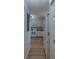 Kitchen area with wood floors and counters, complemented by ample natural light and white cabinetry at 2700 Bayshore Blvd # 1E, Dunedin, FL 34698