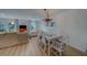 Cozy living room and dining area featuring hardwood floors and ample natural light at 2700 Bayshore Blvd # 1E, Dunedin, FL 34698