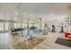 Large recreation room with a ping pong table, pool table, and workout equipment at 2700 Bayshore Blvd # 1E, Dunedin, FL 34698