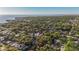 Aerial view of a charming neighborhood with lush greenery and waterfront scenery at 2931 W Coachman Ave, Tampa, FL 33611