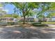 Inviting single-story home on a tree-lined street with charming brick accents at 2931 W Coachman Ave, Tampa, FL 33611