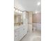 Well-lit bathroom featuring a spacious vanity, decorative accents, and a separate toilet area for added privacy at 400 Island Way # 1708, Clearwater Beach, FL 33767