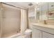 Bright bathroom featuring a tiled walk-in shower and a classic white vanity with ample storage at 400 Island Way # 1708, Clearwater Beach, FL 33767
