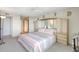 Comfortable bedroom with a built-in headboard, neutral carpet and storage cabinets, creating a serene retreat at 400 Island Way # 1708, Clearwater Beach, FL 33767