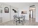Bright dining area features a glass table with seating for four, and a convenient pass-through to the kitchen at 400 Island Way # 1708, Clearwater Beach, FL 33767