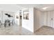 Open-concept dining area with tiled floor and views into the kitchen and entryway at 400 Island Way # 1708, Clearwater Beach, FL 33767