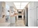 Well-lit kitchen with stainless steel appliances, white cabinetry, and an adjacent dining area at 400 Island Way # 1708, Clearwater Beach, FL 33767