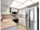 Modern kitchen featuring stainless steel appliances, light countertops, and white cabinets at 400 Island Way # 1708, Clearwater Beach, FL 33767