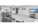 Bright living room with neutral carpet, ceiling fan, and adjacent dining area, great for relaxing and entertaining at 400 Island Way # 1708, Clearwater Beach, FL 33767