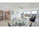 Open-concept living room with a water view, dining area, and neutral decor at 400 Island Way # 1708, Clearwater Beach, FL 33767