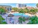 A stunning resort-style pool area surrounded by lush landscaping and inviting lounge chairs at 400 Island Way # 1708, Clearwater Beach, FL 33767