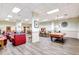 Large recreation room with a pool table, lounge area, multiple dining tables, and wood-look flooring at 400 Island Way # 1708, Clearwater Beach, FL 33767