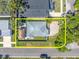 Aerial view of backyard with fenced-in yard, Tiki hut, and green space at 4500 23Rd S Ave, St Petersburg, FL 33711