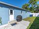 Back exterior features include a grill and door to the home at 4500 23Rd S Ave, St Petersburg, FL 33711