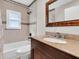 Well-lit bathroom with granite countertop, decorative tiles, and shower at 4500 23Rd S Ave, St Petersburg, FL 33711