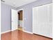 Bedroom with hardwood floors, bi-fold closet doors, and fresh paint at 4500 23Rd S Ave, St Petersburg, FL 33711