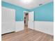 Bedroom featuring bright teal walls, closet, and interior access door at 4500 23Rd S Ave, St Petersburg, FL 33711