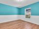 Inviting bedroom with bright teal walls and wood flooring at 4500 23Rd S Ave, St Petersburg, FL 33711