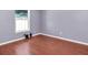 Bedroom featuring wood flooring and a large window at 4500 23Rd S Ave, St Petersburg, FL 33711