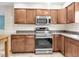 Kitchen with stainless steel oven, microwave, and granite countertops at 4500 23Rd S Ave, St Petersburg, FL 33711