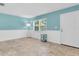 Bright living room with white trim, blue walls, and tiled floor at 4500 23Rd S Ave, St Petersburg, FL 33711