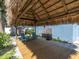 Tiki hut with wooden deck and outdoor seating area at 4500 23Rd S Ave, St Petersburg, FL 33711