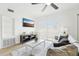 Bright living room with a gray sofa, marble-top coffee table, wood floors, and modern decor for comfortable, stylish living at 5108 Tangelo Dr, New Port Richey, FL 34652