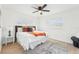 Stylishly decorated main bedroom featuring a window and ceiling fan at 5108 Tangelo Dr, New Port Richey, FL 34652