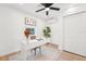 Bright office space featuring a modern white desk, stylish decor, and a ceiling fan at 5108 Tangelo Dr, New Port Richey, FL 34652