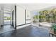 Enclosed porch with black brick floor, a door, and screen door at 5108 Tangelo Dr, New Port Richey, FL 34652