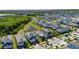 A lovely community is shown with lush greenery, ponds, and well-maintained homes near the water at 5236 Wishing Arch Dr, Apollo Beach, FL 33572