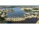 An aerial view of a waterfront community with lush landscaping and a variety of home styles at 5236 Wishing Arch Dr, Apollo Beach, FL 33572